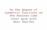 On the degree of symmetric functions on the Boolean cube Joint work with Amir Shpilka.