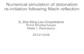 Numerical simulation of detonation re-initiation following Mach reflection