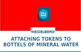 Attaching tokens to bottles of mineral water