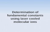 Determination of fundamental constants using laser cooled molecular ions